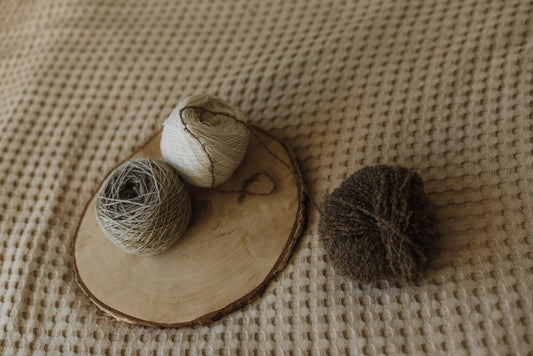brown yarn on brown wooden round plate